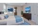 Comfortable main bedroom with neutral tones, decorative lighting, and a connecting bathroom at 9762 Neruda St, Orlando, FL 32827