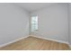 Light-filled room with wood floors and a large window at 9762 Neruda St, Orlando, FL 32827