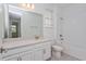 Bright bathroom featuring a vanity, toilet and bathtub at 10185 Pearson Ave, Orlando, FL 32827