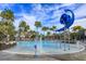 Resort-style pool with water features and palm trees at 10185 Pearson Ave, Orlando, FL 32827