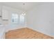 Bright dining area with hardwood floors and large windows at 10185 Pearson Ave, Orlando, FL 32827