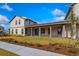 Two-story home with covered patio and manicured lawn at 10185 Pearson Ave, Orlando, FL 32827