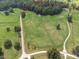 Aerial view of property boundaries, with lush greenery and large open fields, including road frontage at 1951 Nw 114Th Loop, Ocala, FL 34475