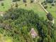 Aerial view of property boundaries, revealing a mix of wooded areas and open fields at 1951 Nw 114Th Loop, Ocala, FL 34475