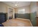 Bedroom features hardwood floors, a ceiling fan, and a small closet at 9701 E Warm Springs Ave, Coleman, FL 33521