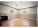 Bedroom features hardwood floors and two windows to let the sunlight in at 9701 E Warm Springs Ave, Coleman, FL 33521