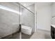 Modern bathroom with freestanding tub and walk-in shower at 13438 Leggett Aly, Orlando, FL 32827