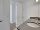 Bathroom with double vanity, dark brown cabinets and gray countertop at 13438 Leggett Aly, Orlando, FL 32827