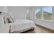 Bright bedroom with a double bed and large windows at 13438 Leggett Aly, Orlando, FL 32827