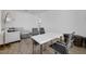White table with four chairs and a sectional sofa in a bright bonus room at 13438 Leggett Aly, Orlando, FL 32827