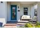 Modern teal front door adds curb appeal to home exterior at 13438 Leggett Aly, Orlando, FL 32827