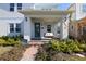 Inviting front porch with seating area, perfect for relaxing at 13438 Leggett Aly, Orlando, FL 32827