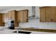 Modern kitchen with stainless steel appliances and white quartz countertops at 13438 Leggett Aly, Orlando, FL 32827