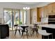 Bright kitchen with a round dining table and access to backyard at 13438 Leggett Aly, Orlando, FL 32827