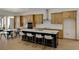 Modern kitchen with island, stainless steel appliances, and light wood cabinets at 13438 Leggett Aly, Orlando, FL 32827
