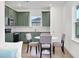 Modern kitchen with green cabinets and stainless steel appliances at 13438 Leggett Aly, Orlando, FL 32827