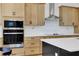 Modern kitchen with built-in microwave and wall oven at 13438 Leggett Aly, Orlando, FL 32827