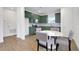 Modern kitchen with green cabinets, stainless steel appliances, and white backsplash at 13438 Leggett Aly, Orlando, FL 32827