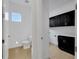Laundry room with black cabinets and light countertops at 13438 Leggett Aly, Orlando, FL 32827