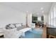 Bright living room features grey sofa and white coffee table at 13438 Leggett Aly, Orlando, FL 32827