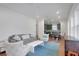 Open concept living room with grey sofa and blue rug at 13438 Leggett Aly, Orlando, FL 32827