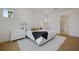 Spacious main bedroom with king bed, white dresser, and en-suite bathroom at 13438 Leggett Aly, Orlando, FL 32827