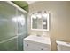 Clean bathroom with updated vanity and shower at 2734 Vindale Rd, Tavares, FL 32778