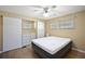 Bedroom with ceiling fan and mirrored closet doors at 2734 Vindale Rd, Tavares, FL 32778