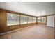 Bright sunroom with wood paneling and ample natural light at 2734 Vindale Rd, Tavares, FL 32778