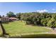 Beautiful backyard with lush green lawn and lake view at 10120 Lakeshore Dr, Clermont, FL 34711