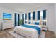 Serene primary bedroom boasts soft colors, plush bedding, and ample natural light at 6370 Trailblaze Bnd, St Cloud, FL 34771
