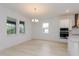 Dining area with modern light fixture, large windows, and an open layout at 6370 Trailblaze Bnd, St Cloud, FL 34771
