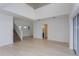 Spacious living room area with high ceilings, plenty of natural light, and access to stairs and hallway at 6370 Trailblaze Bnd, St Cloud, FL 34771