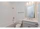 Neat bathroom with shower, vanity, and tile at 13200 Peaceful Melody Dr, Winter Garden, FL 34787