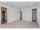 Bright bedroom featuring two closets and carpet flooring at 13200 Peaceful Melody Dr, Winter Garden, FL 34787