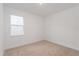 Bright bedroom with a window and carpet flooring at 13200 Peaceful Melody Dr, Winter Garden, FL 34787