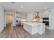 Modern kitchen with island, stainless steel appliances, and white cabinets at 13200 Peaceful Melody Dr, Winter Garden, FL 34787