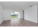 Living room with sliding doors and backyard view at 13200 Peaceful Melody Dr, Winter Garden, FL 34787