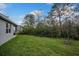 Landscaped backyard with grassy area at 13230 Peaceful Melody Dr, Winter Garden, FL 34787
