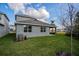 House backyard view with green lawn at 13230 Peaceful Melody Dr, Winter Garden, FL 34787