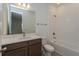 Clean bathroom with tub, toilet and vanity at 13230 Peaceful Melody Dr, Winter Garden, FL 34787