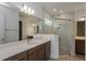 Modern bathroom with a large shower and double vanity at 13230 Peaceful Melody Dr, Winter Garden, FL 34787
