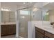 Elegant bathroom featuring a walk-in shower and dual sinks at 13230 Peaceful Melody Dr, Winter Garden, FL 34787
