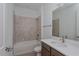 Bathroom with a tub, toilet and modern vanity at 13230 Peaceful Melody Dr, Winter Garden, FL 34787
