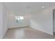 Spacious bedroom with large window and light flooring at 13230 Peaceful Melody Dr, Winter Garden, FL 34787
