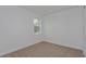 Simple bedroom with carpeted floor and a window at 13230 Peaceful Melody Dr, Winter Garden, FL 34787