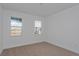 Charming bedroom with two windows and carpet floor at 13230 Peaceful Melody Dr, Winter Garden, FL 34787