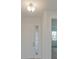 Bright entry hall with white door and small window at 13230 Peaceful Melody Dr, Winter Garden, FL 34787
