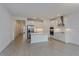 Modern kitchen with white cabinets, stainless steel appliances, and island at 13230 Peaceful Melody Dr, Winter Garden, FL 34787