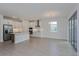 Modern kitchen with island and access to backyard patio at 13230 Peaceful Melody Dr, Winter Garden, FL 34787